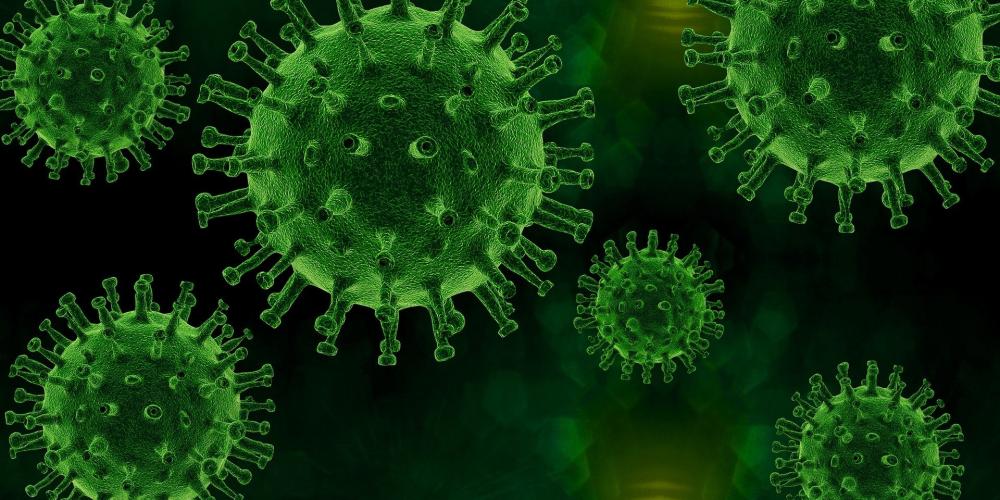 Grüner Virus auf schwarzem Hintergrund